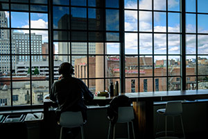 Student studying with view of downtown.