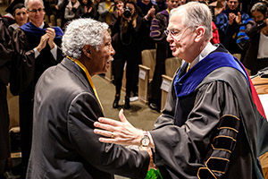 Larry Hopkins and President Hatch shake hands
