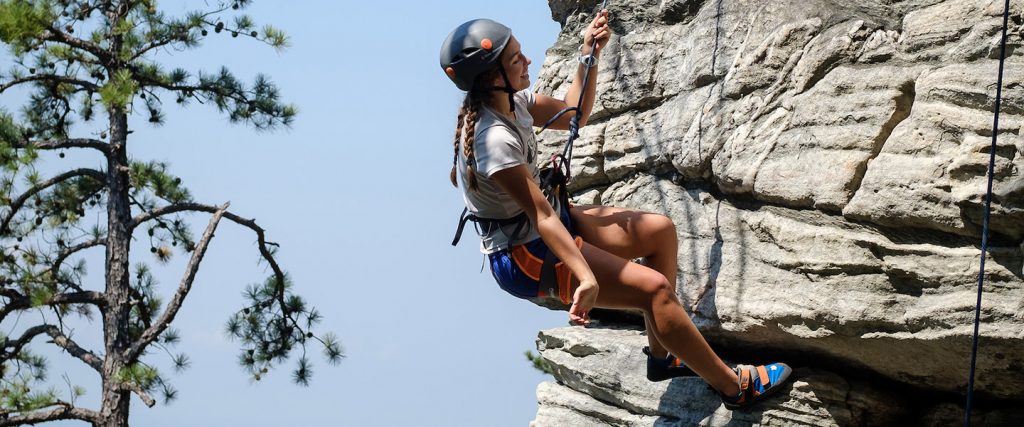 First year students in the Wilderness to Wake pre-orientation program climb at Pilot Mountain State Park.