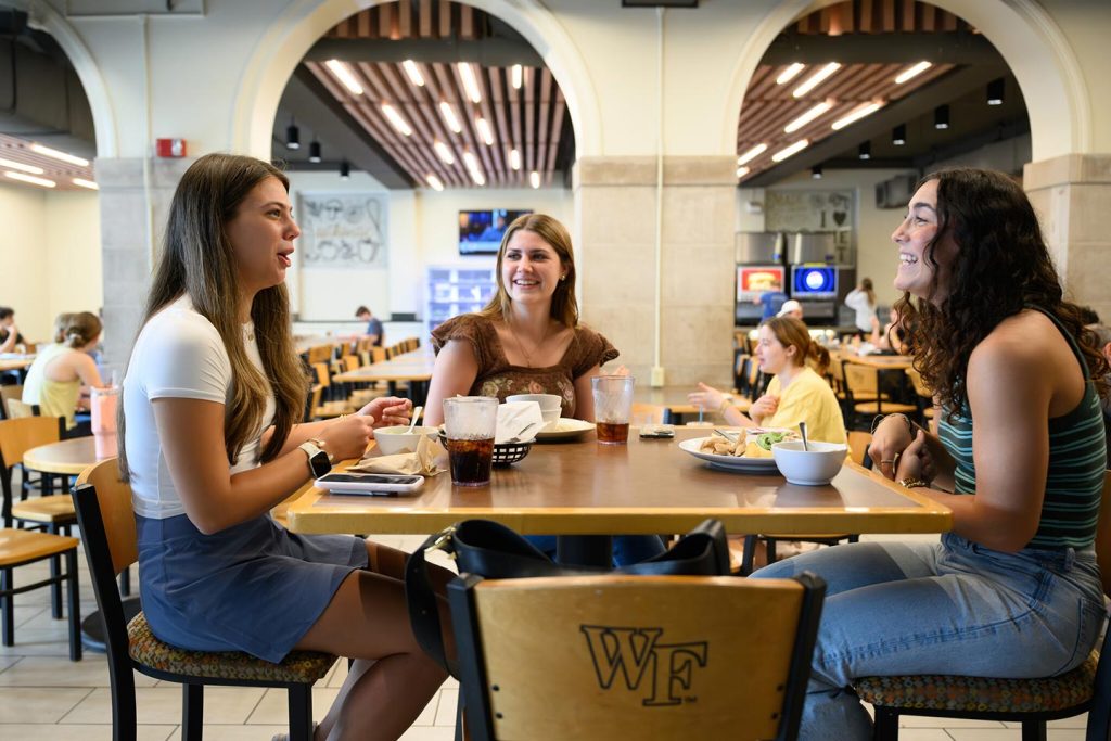 Wake Forest University students enjoy lunch and a few laughs at The Pit in Reynolda Hall.