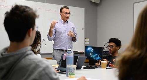 Wake Forest University F. M. Kirby Foundation Chair of Leadership and Character and Senior Executive Director of the Program for Leadership and Character Michael Lamb teaches a class in Greene Hall.
