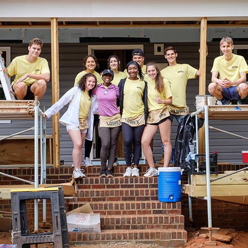 New Wake Forest students in the SPARC pre-orientation program work on a Habitat for Humanity house in Winston-Salem.
