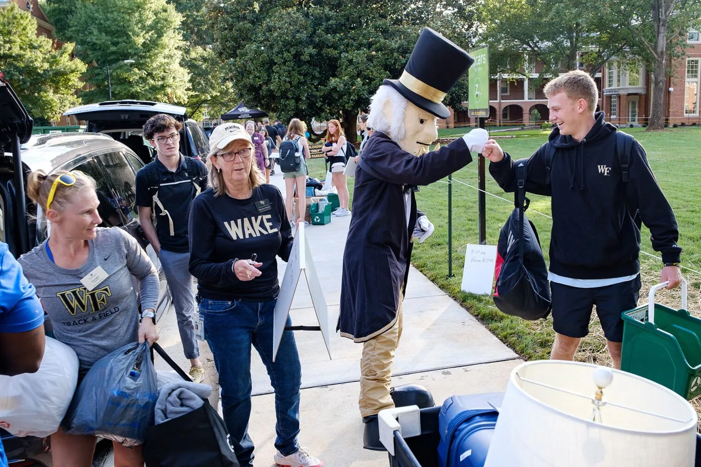 New Wake Forest students move into their residence halls with some help from staff members and athletes.