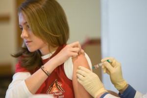 student getting a flu shot