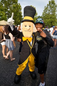 New Wake Forest freshmen enjoy the Taste of Winston-Salem event, in which local restaurants bring samples of their food, outside the soccer stadium on Saturday, August 27, 2011. The Demon Deacon mascot works the crowd.