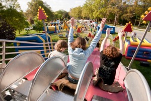 Wake Forest students enjoy carnival rides on Davis Field on Tuesday, April 21, 2009. Dalton Hoffine ('10), Amanda McCrea ('06), and John Harrison ('10) ride the slide.