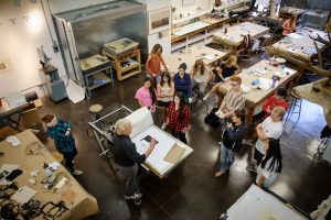 Wake Forest students work on copper plates for intaglio printing (etching) in David Faber's printmaking class in Scales Fine Arts Center.