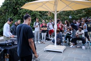 Wake Forest senior Jamerdon Dean ('17), who performs under the stage name Dean Chatham, performs his original music on Manchester Plaza in front of an appreciative crowd.