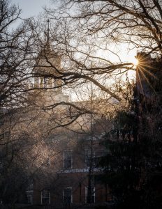 The morning sun rises behind the cupola of the Z. Smith Reynolds Library 