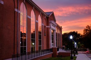 The sunrise reflects in the windows of Reynolds Gym, on the campus of Wake Forest University, Wednesday, November 1, 2017.