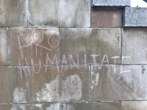 Pro Humanitate chalked on the wall