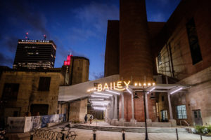 The Bailey Power Plant in downtown Winston-Salem has been renovated into restaurants, event space, and a brewery, shown at dusk on Wednesday, February 27, 2019.