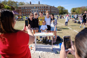 Wake Forest students paint desks for local elementary school students at the annual volunteer service project DESK, on Poteat Field on Wednesday, April 10, 2019.