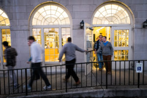 A day in the life of the Reynolda Fresh Foods Company, the Wake Forest dining hall colloquially known as "The Pit." Students outside the Pit at dusk.