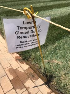 Sign showing the Quad grass is closed to foot traffic