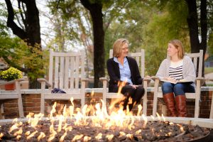 Wake Forest business professor Cynthia Tessien, left, talks with senior Noelle Van Calcar ('17) near the fire pit outside Farrell Hall on Tuesday, November 8, 2016.