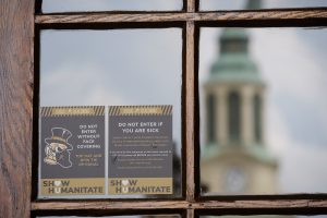 “Show Humanitate” signage detailing appropriate behaviors during the coronavirus pandemic are installed on campus buildings, on the campus of Wake Forest University, Monday, August 10, 2020. The phrase is a play on the university motto, Pro Humanitate (For Humanity.)