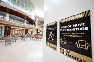“Show Humanitate” signage detailing appropriate behaviors during the coronavirus pandemic are installed on campus buildings, on the campus of Wake Forest University, Wednesday, August 12, 2020.. The phrase is a play on the university motto, Pro Humanitate (For Humanity.) This sign greets visitors in the atrium of Farrell Hall.
