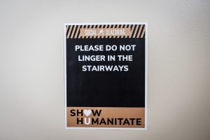 “Show Humanitate” signage detailing appropriate behaviors during the coronavirus pandemic are installed on campus buildings, on the campus of Wake Forest University, Wednesday, August 12, 2020.. The phrase is a play on the university motto, Pro Humanitate (For Humanity.) This sign greets visitors in the School of Law.