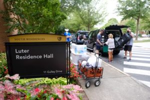 Wagons of belongings being prepped to move into Luter Hall