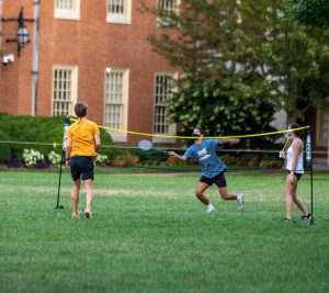 Students play safe. socially distant badminton on the Quad. Photo by Riley Harriman '22.