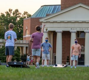 Students play safe. socially distant cornhole on the Quad. Photo by Riley Harriman '22.