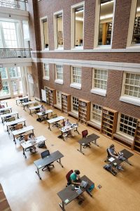 Wake Forest work in the atrium of the Z. Smith Reynolds Library as they wait for classes to begin, on the campus of Wake Forest University, Monday, August 24, 2020.