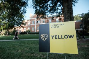 A sign on campus shows the current COVID-19 status, Yellow (New Normal operations), on the campus of Wake Forest University, Wednesday, August 26, 2020.