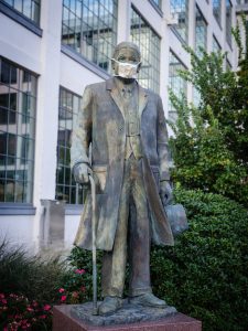 The statue of Bowman Gray stands outside the Wake Forest School of Medicine wearing a mask, on the campus of Wake Forest University, Wednesday, September 9, 2020.
