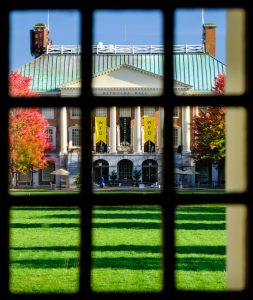 Reynolda Hall, as seen through a window in the front door of Wait Chapel, on the campus of Wake Forest University, Monday, October 19, 2020.