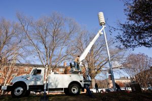 Workers install one of the sirens in the new Campus Alert System on Davis Field on Tuesday, November 18, 2008. The system will have three sirens on 47-foot poles spaced around campus for maximum coverage.