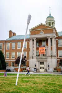 A public art project titled “How Are You Doing, Really?”, created for Art 215 by Meghan Pressimone ('21), stands in front of the library on the campus of Wake Forest University, Tuesday, November 10, 2020. The project consists of a giant nasal swab, and a QR code that leads to a survey on the viewer’s mental health during COVID.