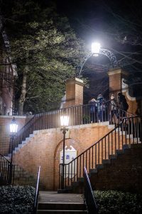 Wake Forest students walk up the stairs to the main quad at night on Tuesday, January 21, 2020.