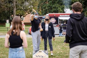 Wake Forest students attend Spring Wake, an outdoor celebration of spring with food trucks, games, and live music, on the campus of Wake Forest University, Saturday, March 13, 2021. It was one of the first large gatherings on campus under the relaxed COVID protocols.