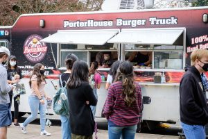 Wake Forest students attend Spring Wake, an outdoor celebration of spring with food trucks, games, and live music, on the campus of Wake Forest University, Saturday, March 13, 2021. It was one of the first large gatherings on campus under the relaxed COVID protocols.
