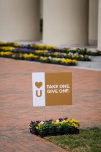 The Office of the Chaplain and the School of Divinity offer flowers to acknowledge the one year anniversary of COVID-19 shutting down the university. The flowers, in small pots, are on the steps of Wait Chapel, on the campus of Wake Forest University, Thursday, March 25, 2021. Members of the community are urged to take one for themselves, and one to give to someone else.