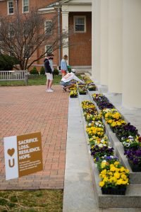 students pick out flowers to take home and give to others