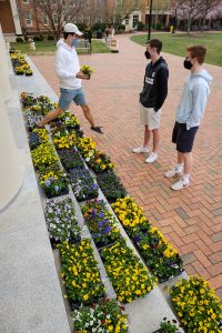 The Office of the Chaplain and the School of Divinity offer flowers to acknowledge the one year anniversary of COVID-19 shutting down the university. The flowers, in small pots, are on the steps of Wait Chapel, on the campus of Wake Forest University, Thursday, March 25, 2021. Members of the community are urged to take one for themselves, and one to give to someone else.