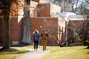 Two students walk in front of Salem Hall, on the campus of Wake Forest University, Wednesday, March 3, 2021.