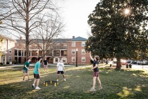 Wake Forest students play spike ball outside Johnson Residence on a warm late winter day, on the campus of Wake Forest University, Wednesday, March 3, 2021.