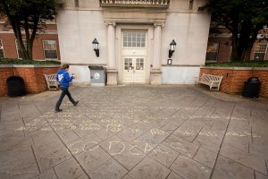 Wake Forest students walk past the sidewalk chalk drawing of the fight song lyrics in front of the Z. Smith Reynolds Library early on the morning of Tuesday, January 29, 2013.