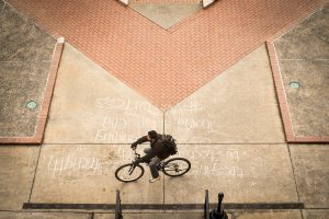 Wake Forest students cross a quote chalked into the sidewalk in front of the Benson Center on Thursday, January 23, 2014.