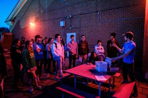 Wake Forest students learn to calculate the diameter of celestial objects using a telescope and basic trigonometry, in their astronomy class in Olin Hall on the evening of Thursday, March 28, 2019. The observation deck is bathed in red light to maintain the students' night vision.