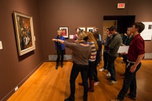 Wake Forest biology professor Kathy Kron (in blue jacket) takes her Biology 105 students to the Reynolda House Museum of American Art to view depictions of plants in the still life exhibit on Tuesday, November 5, 2013.
