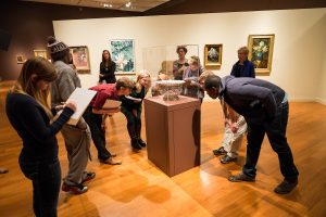 Wake Forest biology professor Kathy Kron (in blue jacket) takes her Biology 105 students to the Reynolda House Museum of American Art to view depictions of plants in the still life exhibit on Tuesday, November 5, 2013.