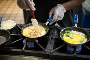 A day in the life of the Reynolda Fresh Foods Company, the Wake Forest dining hall colloquially known as "The Pit," on Tuesday, January 14, 2014. Billy Parks, Jr., hustles to make omelets for students.