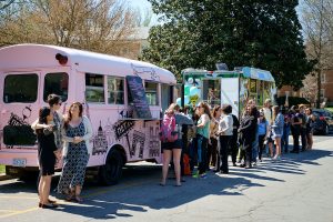 Wake Forest students enjoy lunch from two food trucks parked on the south campus as part of Global Wake Week on Friday, March 18, 2016.