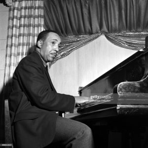 Pianist Red Garland of the Miles Davis Groupo performs onstage on October 18, 1955 in New York. (Photo by PoPsie Randolph/Michael Ochs Archives/Getty Images)