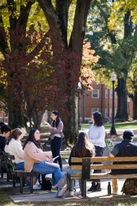 Wake Forest East Asian Languages professor Yuyun Lei (wearing glasses) and her teaching assistant, Mengmeng Shi, teach a Chinese class outside Carswell Hall on Wednesday, November 10, 2021