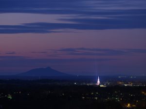 For the annual Wake Forest Lovefeast, a carbon arc searchlight casts a pillar of light into the night sky above Wait Chapel, on the campus of Wake Forest University, Sunday, December 6, 2020.
